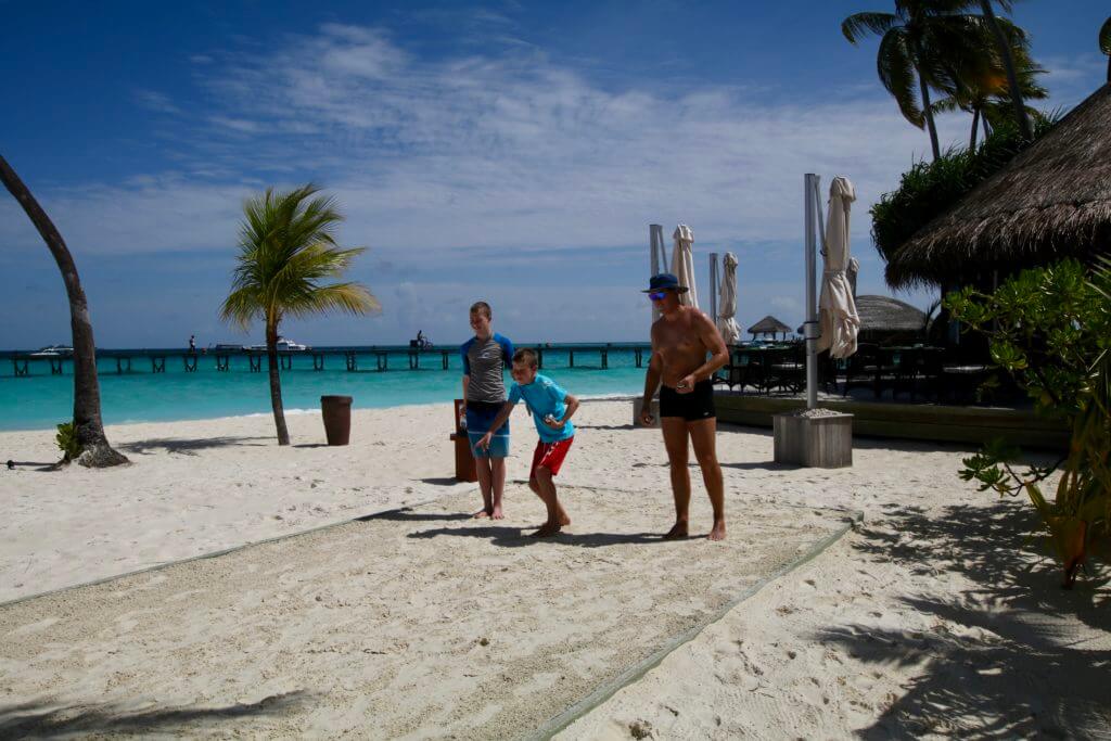 playing beach games with family